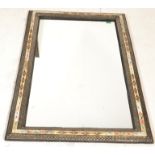 An unusual Moorish - Moroccan wall mirror having a stained camel bone inlaid cushion border with