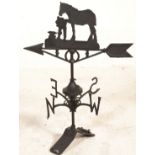 A 20th Century cast iron weather vane having North South East and West appendages with rotating