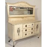 A 20th century Shabby Chic Edwardian mahogany painted mirror back sideboard dresser. Raised on