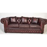 An Antique style red oxblood Chesterfield button back chesterfield 3 seat sofa settee in stunning