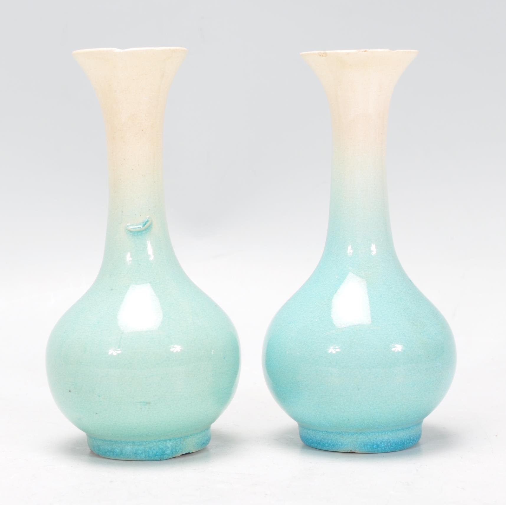 A pair of Japanese porcelain bottle vases vases with tapering cylindrical necks with flared necks - Image 4 of 6