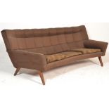 A retro mid century Danish / Scandinavian crescent shaped sofa settee. Raised on square tapering