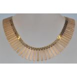 A hallmarked vintage 1970's 9ct gold collar necklace having rectangular bark effect links with a