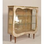 A retro mid century, circa 1950's formica china display cabinet vitrine. Raised on dansette legs