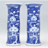 A matching pair of 19th Century Chinese Kangxi porcelain vase of trumpet form having a flared rim