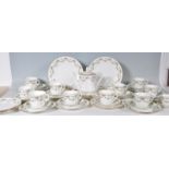 A vintage early 20th century bone china tea service by Phoenix Ware having a chintz swag pattern.