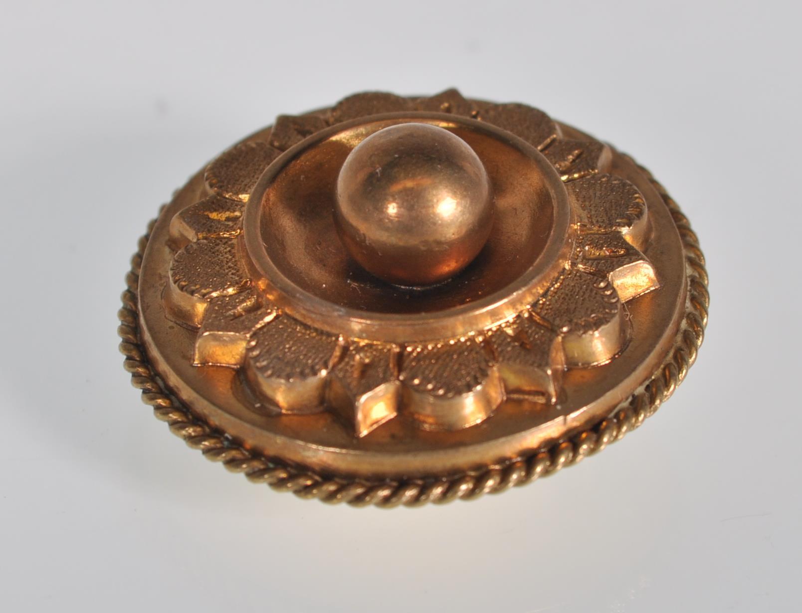 A 19th Century Victorian gold tone brooch of circular form with raised and engraved decoration - Image 2 of 3