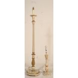 A 20th Century carved wooden standard lamp being raised on a reeded column with knopped stem on a