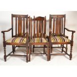 A 1920's set of 6 oak rail back dining chairs. The set of 4 oak chairs with drop in contemporary