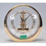 A modern 20th century Seiko Japan modernist Quartz clock with open clockwork movement in roundel