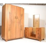 A 1930's Art Deco drop centre walnut dressing table together with a matching double armoire