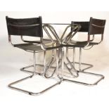 A late 20th Century retro vintage dining suite comprising of a chromed tubular and glass round