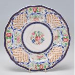 A 19th Century Chinese polychrome plate for the Persian market, decorated with a peony to the