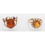 Two 9ct gold ladies dress rings to include one set with a round cut orange stone with a halo of seed