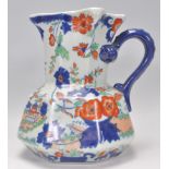 A large Ironstone china Hydra jug in polychromatic colours having blue hydra handle being marked