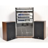A retro late 20th century hi-fi JVC stacking system complete in the cabinet and with speakers. To