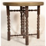 A good quality early 20th century carved barley twist oak and brass folding Binares table. The