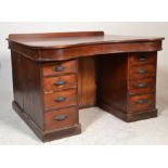 A Victorian 19th century large mahogany serpentine fronted twin pedestal office desk. The plinth