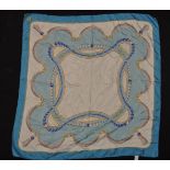 A vintage ladies Must De Cartier silk scarf having a blue ground with a pearl necklace themed