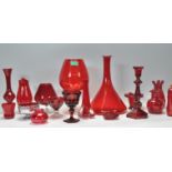 A large collection of mid century retro studio art glass in cranberry, red and ruby flash red