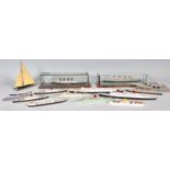 A collection of model die cast model boats by Tri-ang to include SS France, RMS Queen Elizabeth, RMS