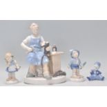 A group of four German Carl Scheidig  porcelain figurines to include a cobbler, a girl with flowers,