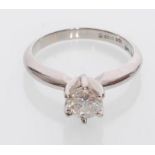 An 18ct white gold solitaire ring inset with a brilliant cut single diamond estimated at 50 points