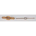 A good 9ct yellow gold bar brooch of slender form having an oval faceted cut blue stone set to a