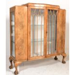 A good Queen Anne 1930's revival walnut china display cabinet vitrine being raised on claw and