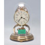 A 20th Century Schatz anniversary clock having a round face with a white enamelled dial having