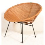 A vintage retro 20th Century wicker satellite sputnik atomic chair raised on ebony tubular legs