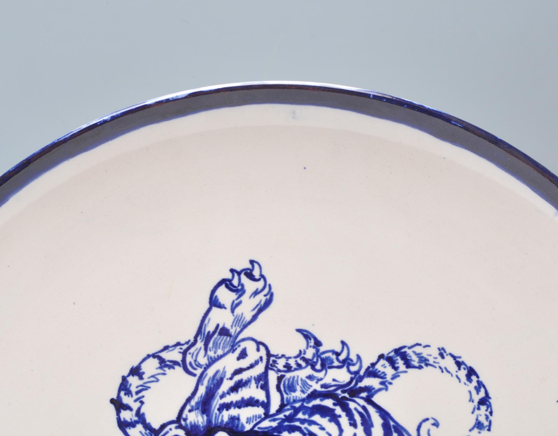 A large early 20th Century English blue and white charger plate in the manor of Frederick Rhead - Image 2 of 9