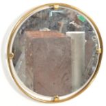 A retro mid century Italian porthole brass mirror having a roundel frame with pierced innner