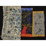 A group of three vintage LIberty printed silk scarves to include a graphic print scarf, a grey