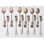 A set of six vintage continental silver coffee spoons having moulded rose head handles with engraved