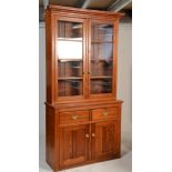 A Victorian 19th century country pitch pine library bookcase cabinet. The base with twin door