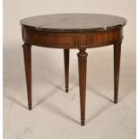A 20th century mahogany and marble French Empire revival occasional table of circular form. Raised