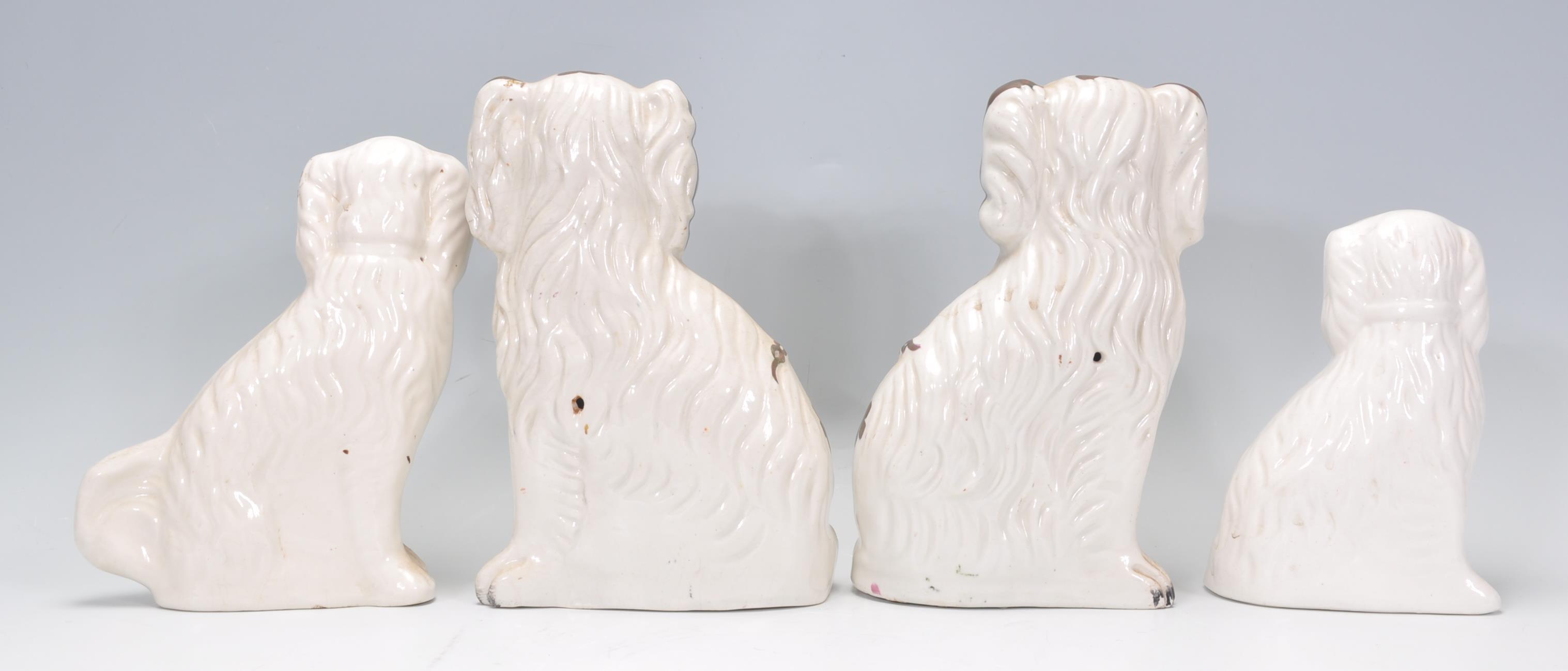 A group of four 19th Century Victorian fire side staffordshire dogs to include two large and two - Image 3 of 7
