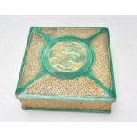 An early 20th Century Chinese ceramic box of square form having green glazed borders with dragon