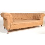 A Victorian 19th century mahogany Chesterfield sofa settee. Raised on square tapering legs with