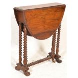 A 19th century Victorian walnut drop leaf sutherland occasional table being raised on splayed feet