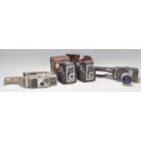 A group of vintage 20th Century cameras to include two Ross Ensign Ful-Vue Super cameras both in