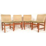 A stunning set of four retro mid 20th Century teak framed dining chairs having fabric covered seat