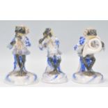 A group of three 20th Century Sitzendorf German porcelain frog band figures to include a flute