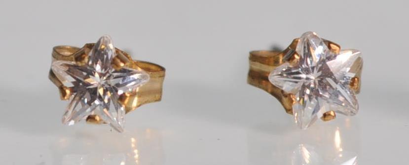 A group of three pairs of 9ct yellow gold earrings to include a pair of star cut white stones, - Image 4 of 5