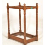A Victorian oak 19th century stick stand. Each column being carved in a candy twist design rising to