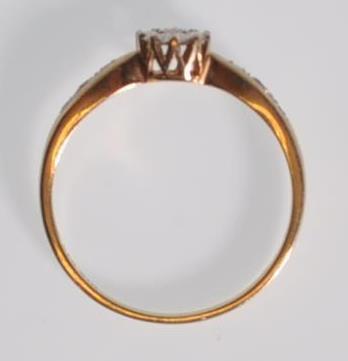 A hallmarked 9ct yellow gold ladies ring having a central round cut diamond set within a starlike - Image 5 of 7