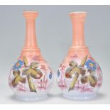 A matching pair of 19th Century Victorian hand painted milk glass vases of bulbous form having