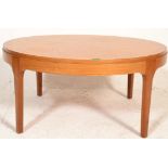 A retro 20th century teak wood rectangular coffee - occasional table of rectangular form raised on