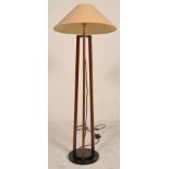 A 20th century Art Deco style mahogany and ebonised wood standard lamp. The floor standing lamp with